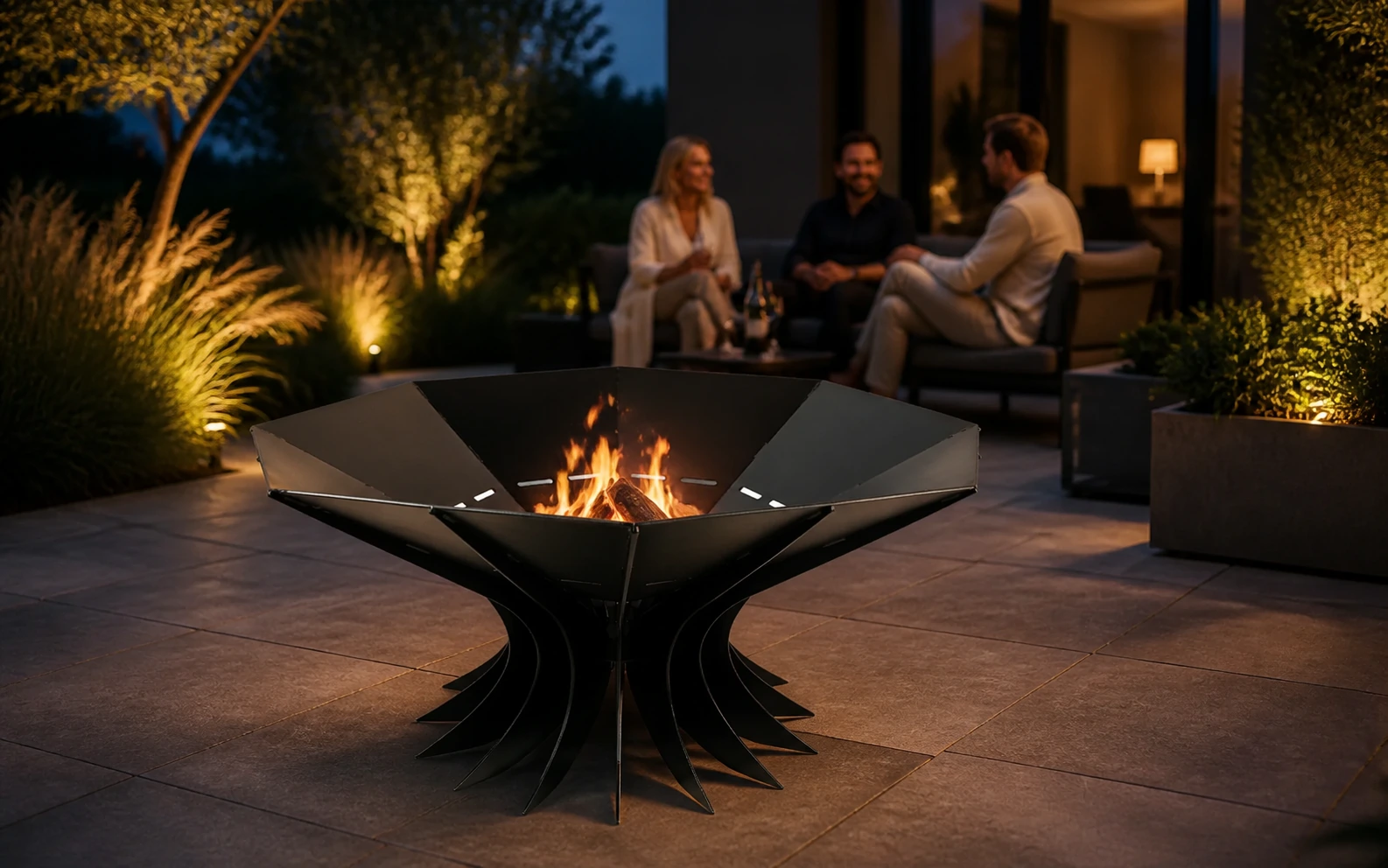 MiFIRE LOTUS fire pit glowing on a modern garden terrace